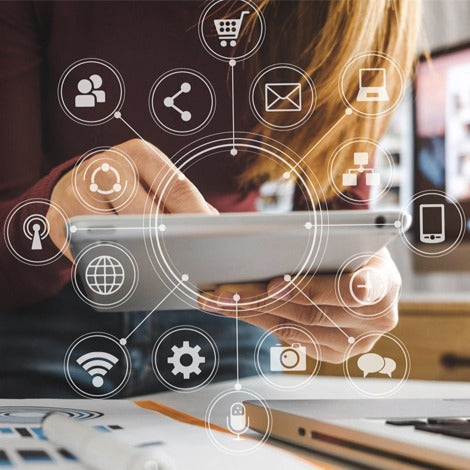Person using a tablet with online shopping and communication icons